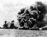 The attack on Pearl Harbor was a surprise military strike conducted by the Imperial Japanese Navy against the United States naval base at Pearl Harbor, Hawaii, on the morning of December 7, 1941 (December 8 in Japan).<br/><br/>

The attack was intended as a preventive action in order to keep the U.S. Pacific Fleet from interfering with military actions the Empire of Japan was planning in Southeast Asia against overseas territories of the United Kingdom, the Netherlands, and the United States.<br/><br/>

The attack came as a profound shock to the American people and led directly to the American entry into World War II in both the Pacific and European theaters. The following day (December 8) the United States declared war on Japan.  Domestic support for isolationism, which had been strong, disappeared. Clandestine support of Britain (for example the Neutrality Patrol) was replaced by active alliance. Subsequent operations by the U.S. prompted Germany and Italy to declare war on the U.S. on December 11, which was reciprocated by the U.S. the same day.<br/><br/>

Despite numerous historical precedents for unannounced military action by Japan, the lack of any formal warning, particularly while negotiations were still apparently ongoing, led President Franklin D. Roosevelt to proclaim December 7, 1941, 'a date which will live in infamy'.
