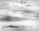 USA / Japan: USAF F4U and F6F planes fly in formation over the USS Missouri and elements of the US fleet in Tokyo Bay during the Japanese surrender ceremonies, September 2, 1945